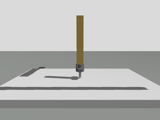 Gazebo view of a generated Cartesian gantry robot with its gripper lowered to the bed.